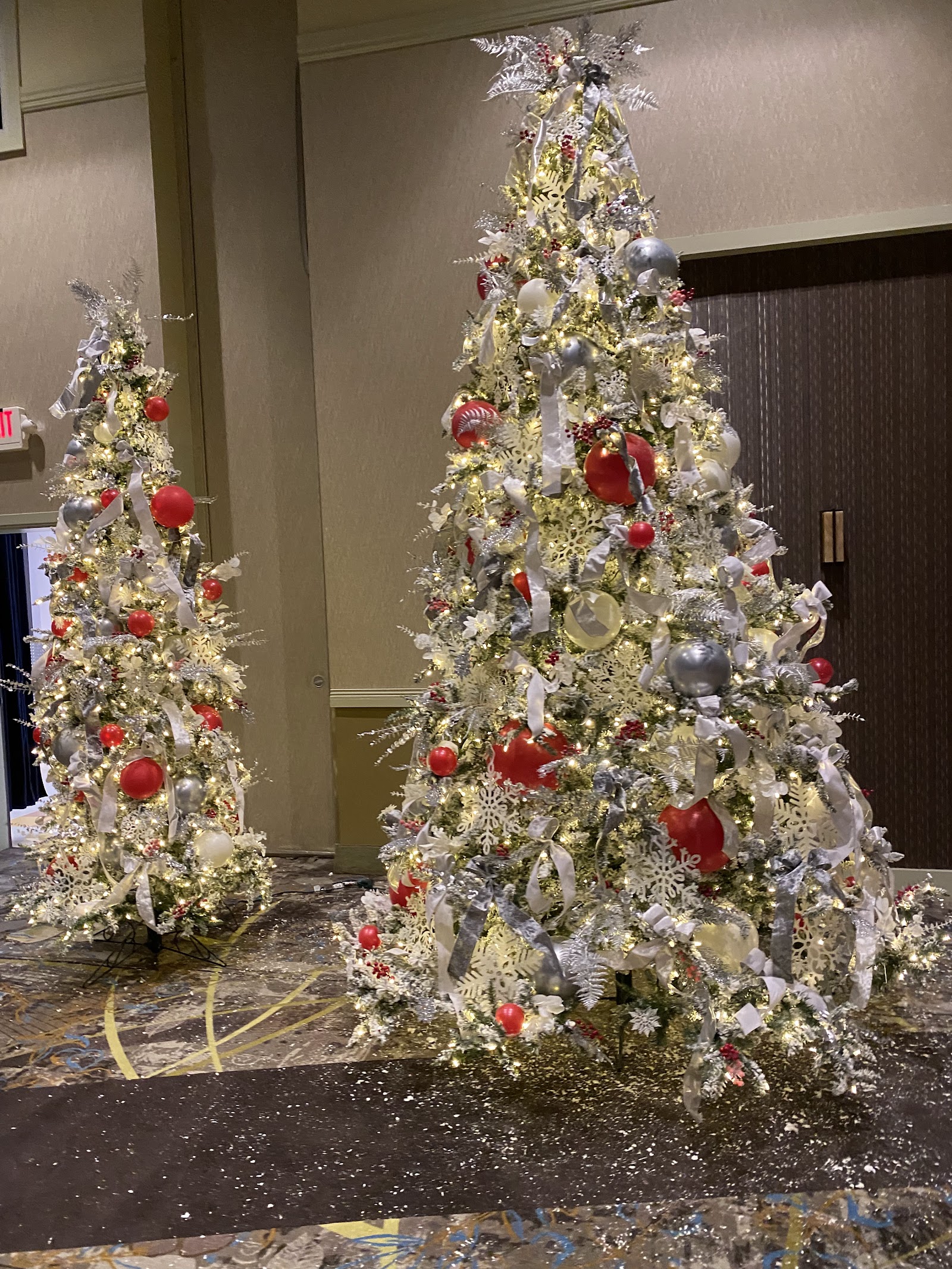 Elegant Christmas trees decorated in silver and red